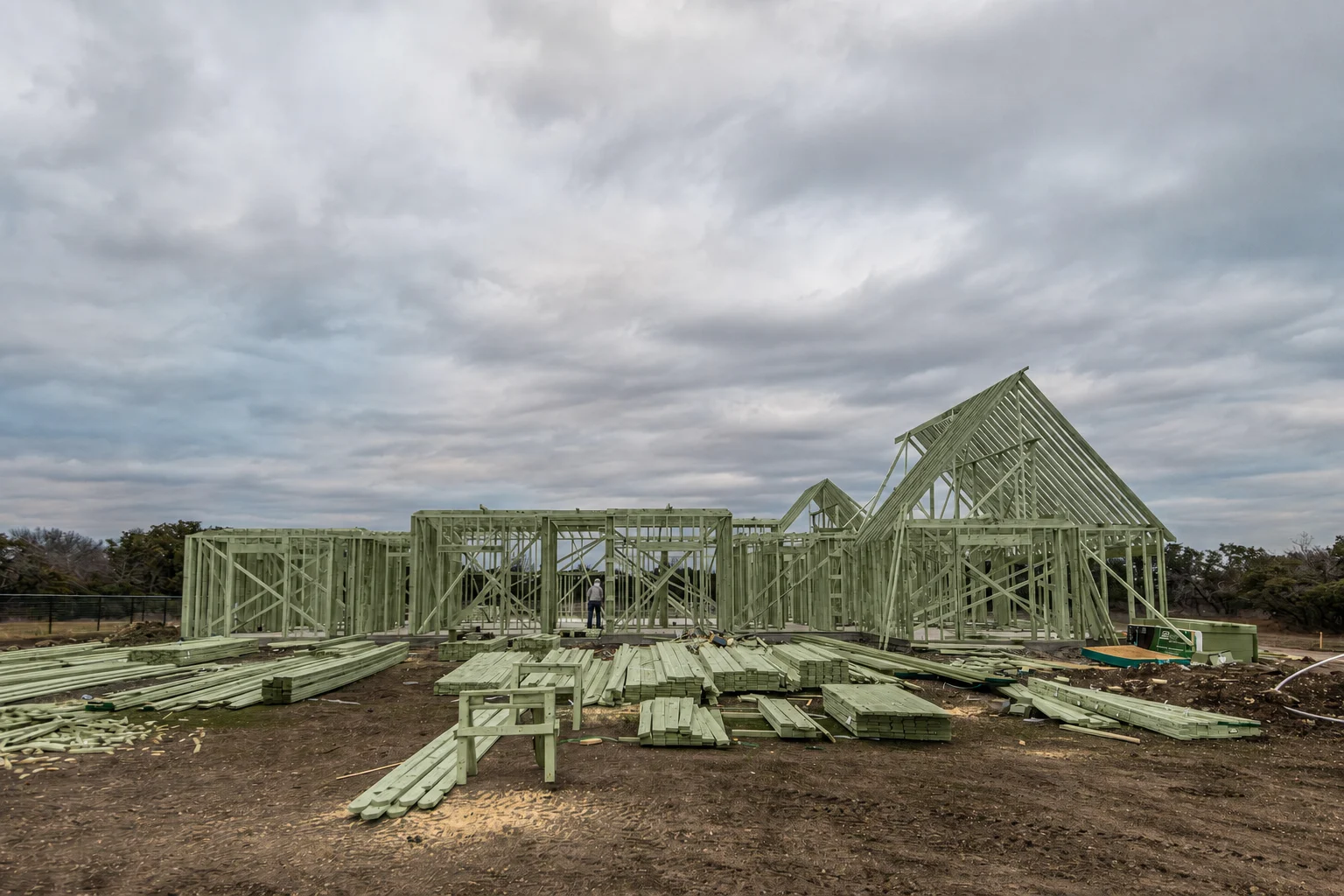 Authentic residential house frame with subtly green treated structural lumber